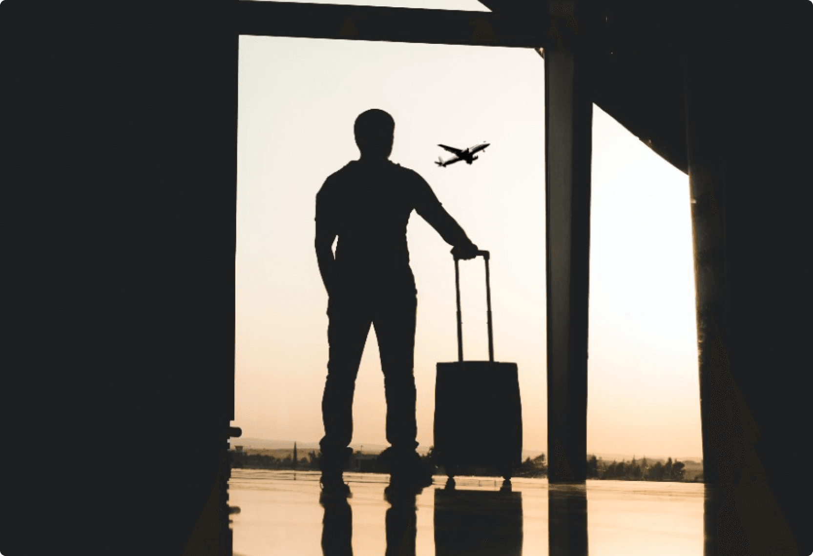 silhouette of man with luggage